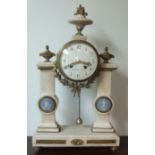 A French portico mantle clock with marble columns