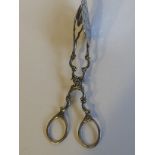 A pair of Swedish hallmarked dessert tongs with with foliate scroll detailing L9.5cm