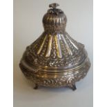 A Turkish silver hallmarked embossed Ottoman style urn with lid the hinged top decorated with