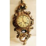 A C19th Swedish gilt Rococo style Cartell clock of acanthus scrolled form the enamel painted dial