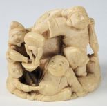 A Japanese carved ivory okimono depictin