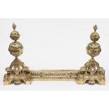 A pair of cast brass Continental andiron