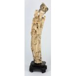 A Chinese carved ivory figure of Kuan-yi