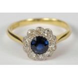 An 18ct gold, sapphire and diamond circu