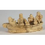 A Japanese ivory netsuke of four men in