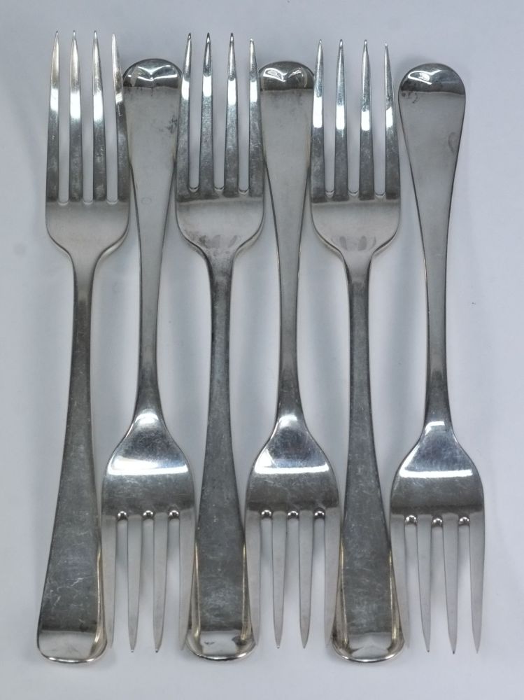 Six George III silver table forks, vario