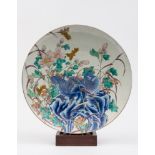 An Arita porcelain charger: painted in u