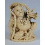 A Japanese carved ivory netsuke depictin