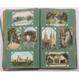 An early 20th century postcard album of