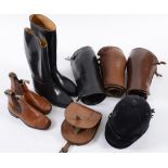 Two pairs of black riding boots, a pair