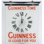 A  glass and chrome 'Guinness Time' adve