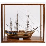 A cased model of HMS Bounty:, standing a