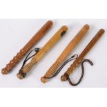 Four various plain turned wood truncheon