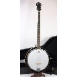 An Ozark five string banjo in fitted cas