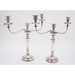 A pair of ep twin branch candelabra: the