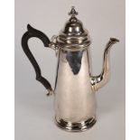 A George V silver coffee pot, maker HEB.