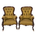 A pair of Victorian carved mahogany armc