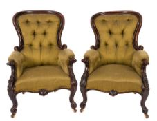 A pair of Victorian carved mahogany armc