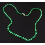A graduated green jade bead single strin