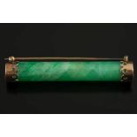 A cylindrical green jade rod mounted bar