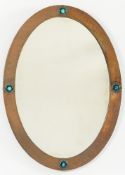 A hammered copper framed oval mirror:, w