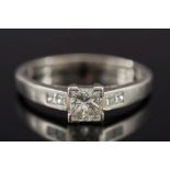 A platinum and princess-cut diamond sing