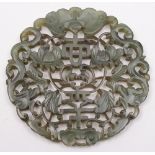 A Chinese carved pale green jade disc: o