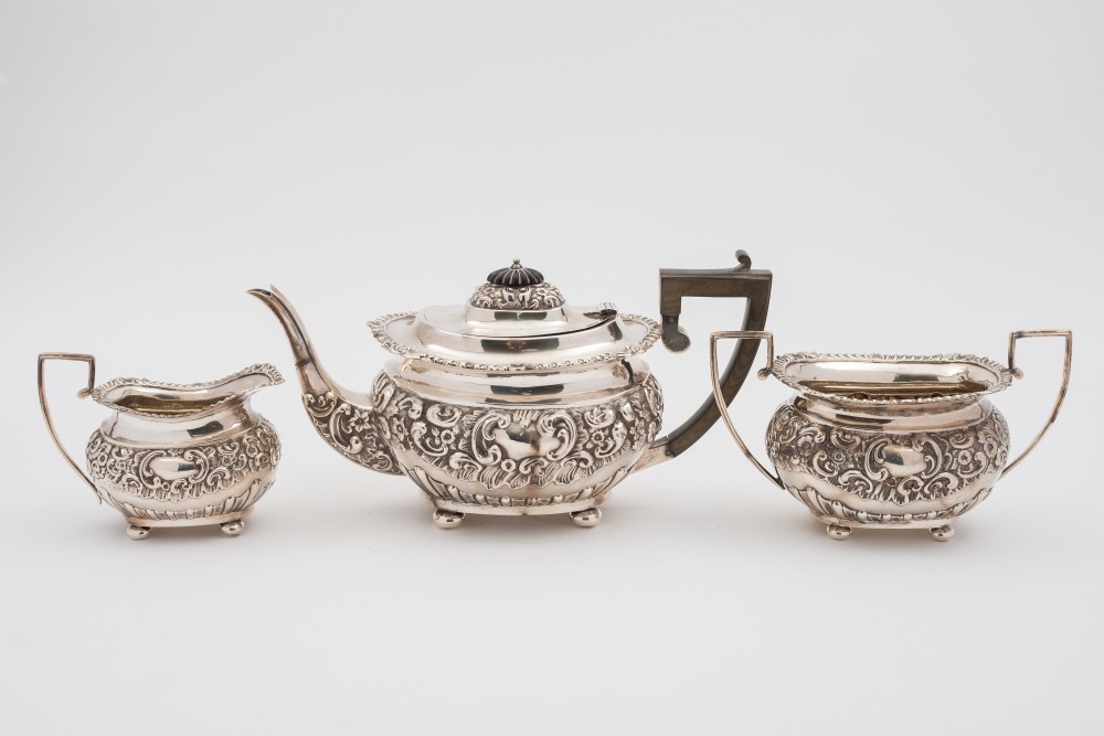 An Edward VII silver three - piece tea s