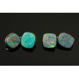 A pair of opal doublet mounted cuff-link