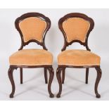 A set of twelve Victorian mahogany dinin