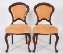 A set of twelve Victorian mahogany dinin