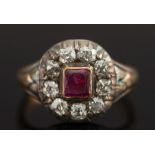 A ruby and diamond oval cluster ring:, w