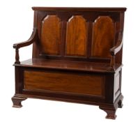 An Edwardian mahogany box settle:, of fi