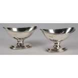 A pair of George V silver pedestal salts