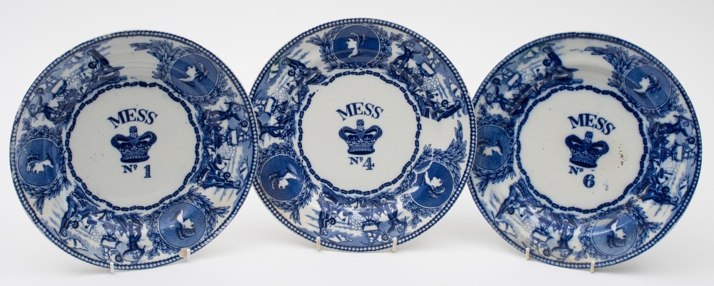 Three Bovey Tracey Pottery blue and white mess plates:, 'young head' pattern for mess No 1,