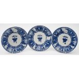 Three Bovey Tracey Pottery blue and white mess plates:, 'young head' pattern for mess No 1,