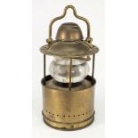 A circular brass ship's lamp:,