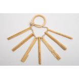 A 19th century set of seven sailorwork marine ivory model tools:, mainly rasps and a flensing knife,