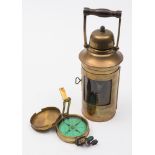 A brass cased 2 1/2 inch dry card prismatic compass by Elliott Brothers  London,