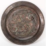 A Newlyn style copper dish:, with central repousse decoration of two fish circling a worm, unsigned,