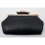 A lady's black leather Ocean liner themed evening bag for Bentalls of London: the three colour