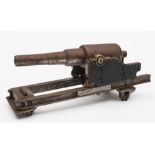 A steel and brass model of a coastal battery cannon:,