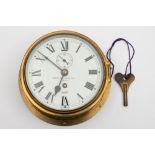 A brass bulkhead clock by Sestral for Negretti and Zambra Ltd, London:,