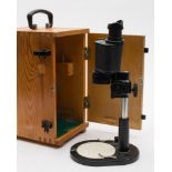 A Russian bM-51-2 binocular microscope:, in a pine case.