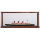 A cased waterline model of The Queen Mary:, with davits and lifeboats to decks, in a glazed case,