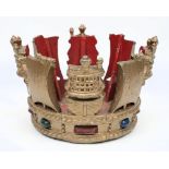 An Admiralty pattern cast aluminium crown:, painted in colours on a gold ground, 18cm high,