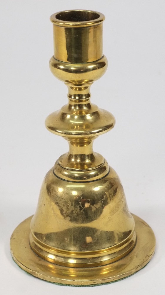 A ship's brass candlestick: with weighted base,