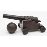 A cast iron model of a cannon:, the 11 inch four stage barrel with plain trunnions and touch hole,