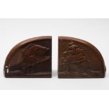 A pair of mid 20th century maritime themed mahogany bookends:, one carved with leaping fish ,