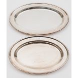 Two silver plated serving dishes with shipping line engraved logos:, (emblems worn), 31cm and 36cm.